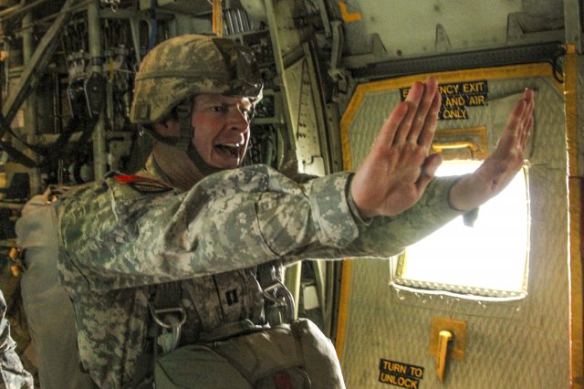 Jumpmaster giving commands to paratroopers before the door is opened.